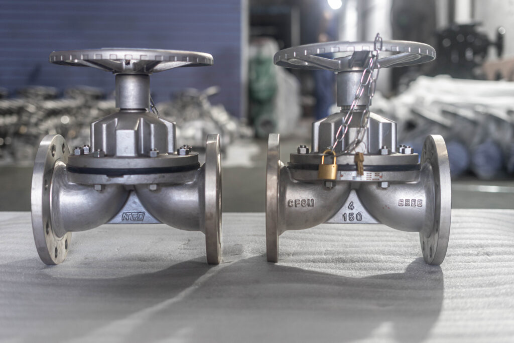 Two NTGD 4-inch Class 150 CF8M manual weir-type diaphragm valves in the workshop.